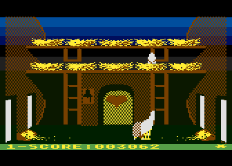 Chicken Chase (Atari 8-bit) screenshot: Pecking the rat to protect the egg.