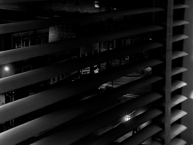 Noir: A Shadowy Thriller (Windows 3.x) screenshot: Street view from the window