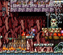 Jim Power: The Lost Dimension in 3D (SNES) screenshot: Jim fights his way past a big head