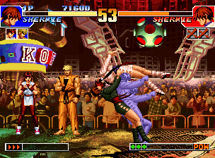 The King of Fighters '97 (Neo Geo CD) screenshot: With a perfect timing, P1 Shermie strikes back P2 Shermie through her grabbing DM Shermie Carnival.