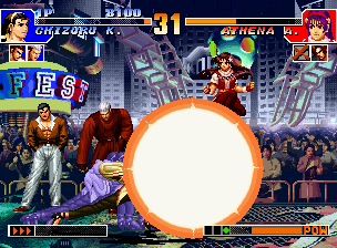 The King of Fighters '97 (Neo Geo CD) screenshot: Using a simple jump, Athena attempts to avoid Chizuru Kagura's SDM Rimen 85 Katsu: Reigi no Ishizue.