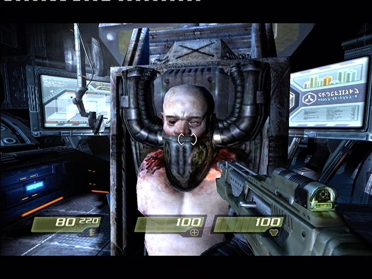 Quake 4 (Xbox 360) screenshot: The Strogg use humans to run their strange machines.