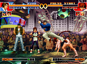 The King of Fighters '97 (Neo Geo CD) screenshot: Using the Emergency Evade command, Shermie gets to avoid Robert Garcia's move Hien Ryuujin Kyaku...