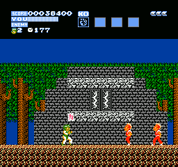 Flying Dragon: The Secret Scroll (NES) screenshot: Collecting an item power-up from a miniboss.