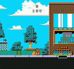 Wally Bear and the NO! Gang (NES) screenshot: Getting bit by a dog.