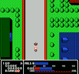 Rally Bike (NES) screenshot: Driving through a suburban area.