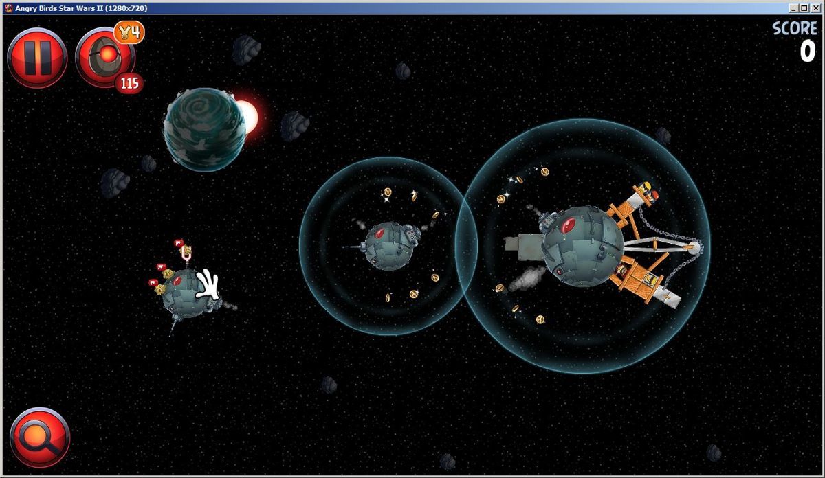Angry Birds: Star Wars II (Windows) screenshot: Eventually the Pork Side levels move into space. Here the magnifying glass in the bottom left becomes more useful as it allows the player to zoom out and see the whole level