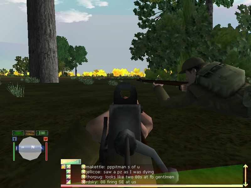 WWII Online: Blitzkrieg (Windows) screenshot: Taking cover from the enemy as we advance on a city.