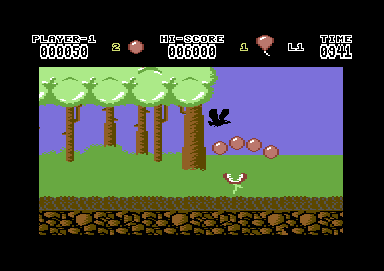 Hoppin' Mad (Commodore 64) screenshot: Jumping over a venus fly trap