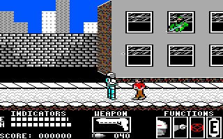 RoboCop (TRS-80 CoCo) screenshot: Playing level 1 - getting chased and shot at
