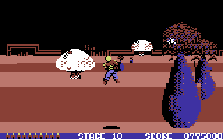 Space Harrier (Commodore 64) screenshot: Stage 10 - mushrooms again, some of them now act like space ships
