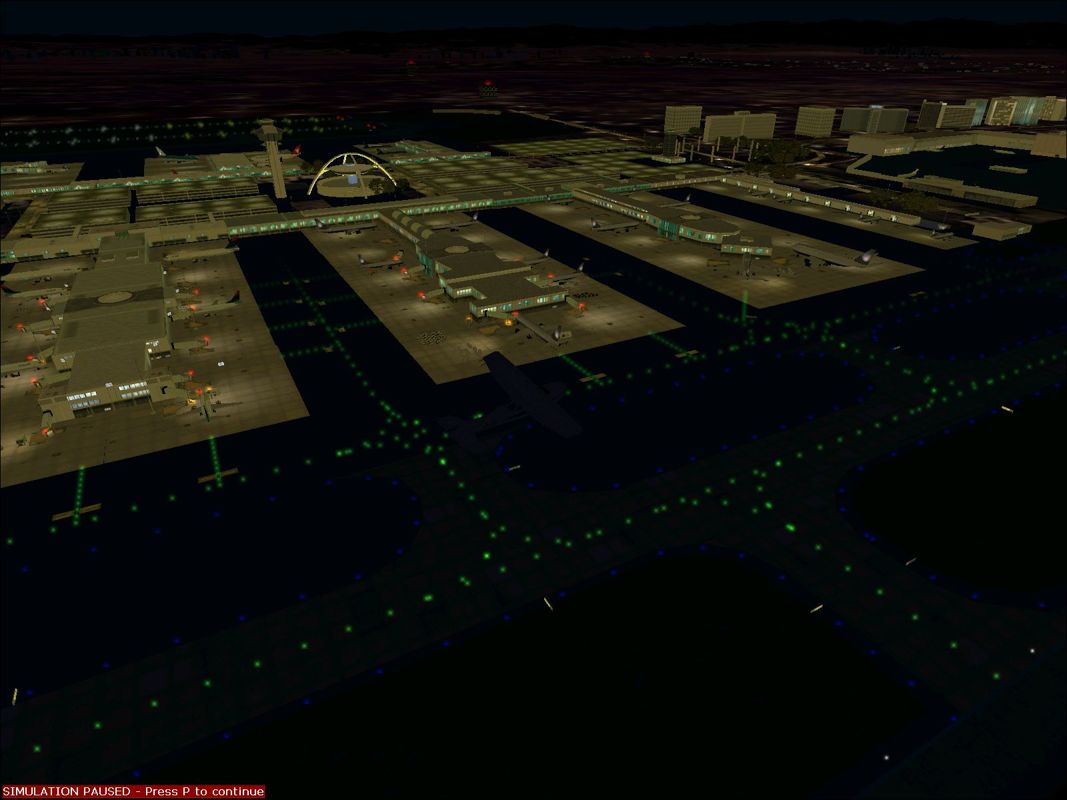 World Airports (Windows) screenshot: Los Angeles airport at night using the new scenery. Not quite as exciting but probably more realistic. Lots of flashing lights on vehicles, planes, buildings etc