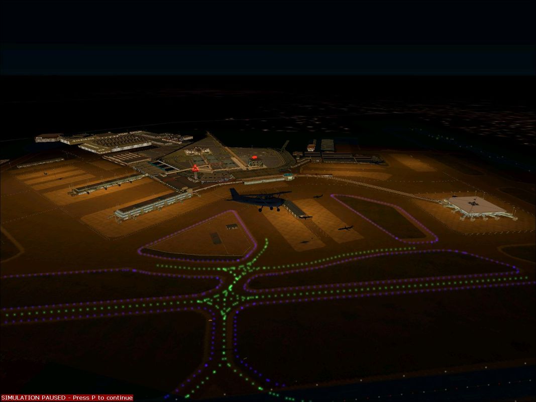 World Airports (Windows) screenshot: Rome's Fiumicino airport buildings at night using the enhanced scenery