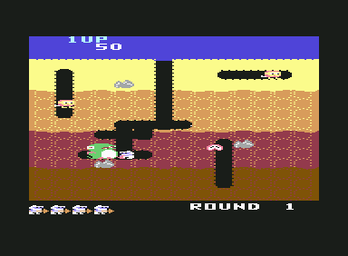 Dig Dug (Commodore 64) screenshot: Blowing up an enemy.