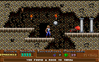 Xargon (DOS) screenshot: Throwing boulders at giant beetles of some sort.