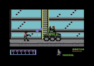 Midnight Resistance (Commodore 64) screenshot: Fighting a tank.