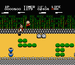 Ganbare Goemon! Karakuri Dōchū (NES) screenshot: Battle in a forest