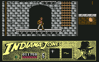 Indiana Jones and the Last Crusade: The Action Game (Commodore 64) screenshot: Climbing up the walls of Castle Brunwald.
