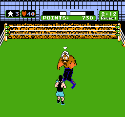 Mike Tyson's Punch-Out!! (NES) screenshot: Punching Great Tiger in the stomach and getting a star. You need stars to be able to perform uppercuts.
