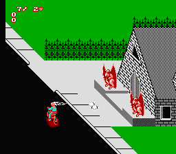 Paperboy 2 (NES) screenshot: A strange house with two gargoyles shooting at me. I shoot right back