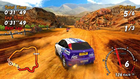 SEGA Rally Revo (PSP) screenshot: Skidding through the sand of this Canyon track.