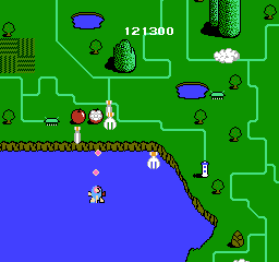 TwinBee (NES) screenshot: The player gets bonuses for killing land objects