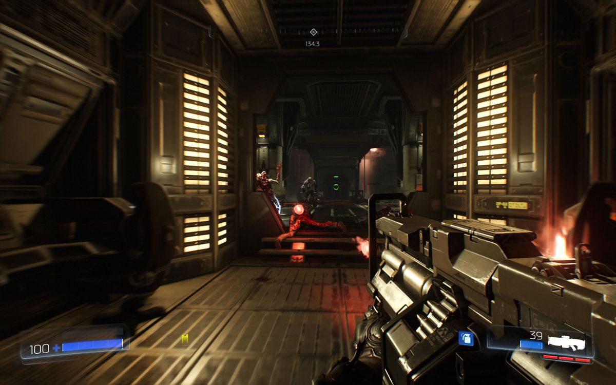 Doom (Windows) screenshot: A narrow corridor, carrying the heavy assault rifle.