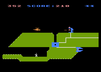 Chopper Rescue (Atari 8-bit) screenshot: Shooting at the fixed missile launcher