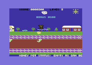 Scare Bear (Commodore 64) screenshot: Dropping a honey ball onto a snake