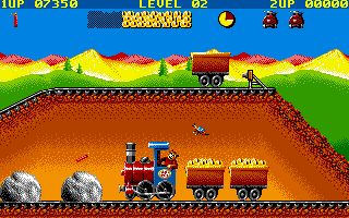 Guldkorn Expressen (DOS) screenshot: Throwing a bar of dynamite at the rock.