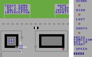 Siren City (Commodore 64) screenshot: A good bit of product placement on the signs, well they do say it pays to advertise