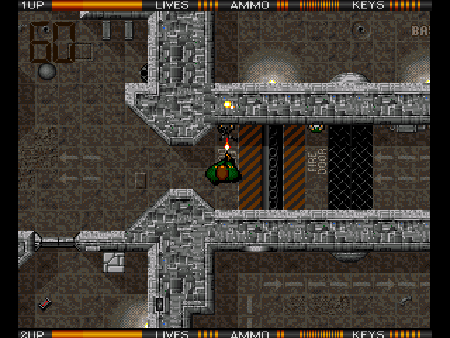 Alien Breed (Amiga) screenshot: Taking out the door switch on either side will seal these doors for good.