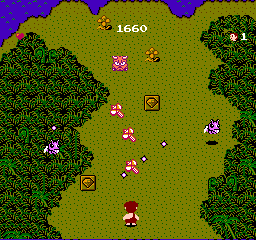 Adventures of Dino-Riki (NES) screenshot: Throwing a hammer weapon at enemies