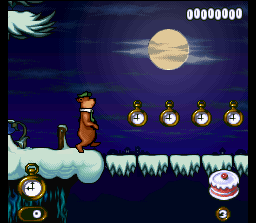 Adventures of Yogi Bear (SNES) screenshot: Yogi is about to cross a bridge and collect some clocks!