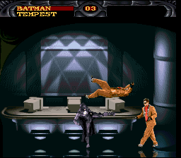 Batman Forever (SNES) screenshot: Batman beating up some surprisingly well-dressed thugs