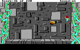 The Black Cauldron (DOS) screenshot: Climb up the castle walls while avoiding the falling rocks.