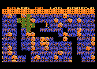 Boulder Dash (Atari 8-bit) screenshot: The slime isn't deadly, but grows quickly and takes up space