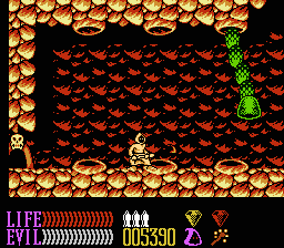 Wizards & Warriors III: Kuros - Visions of Power (NES) screenshot: Fighting a worm boss