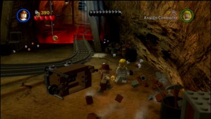 LEGO Indiana Jones: The Original Adventures (PlayStation 3) screenshot: Gotta find a working cart in these tunnels to go further down the tracks.