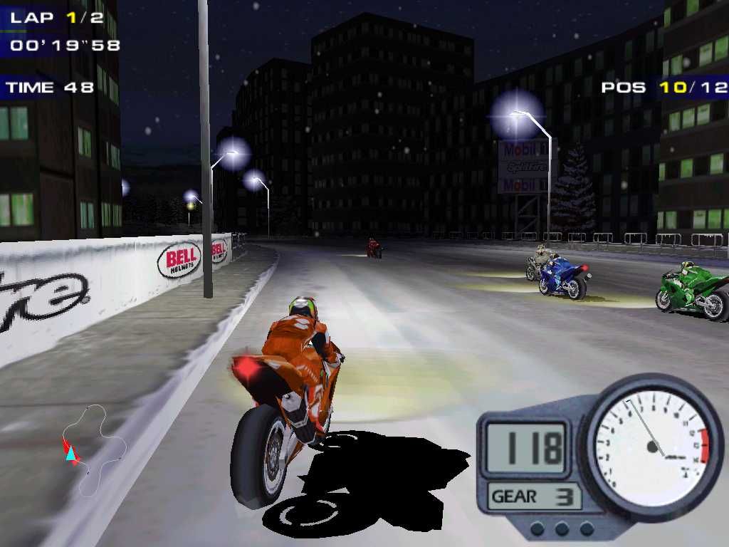 Moto Racer 2 (Windows) screenshot: Racing a superbike through a city during a snowy night