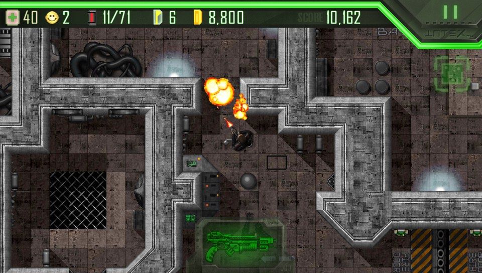 Alien Breed (PS Vita) screenshot: Shooting an alien.