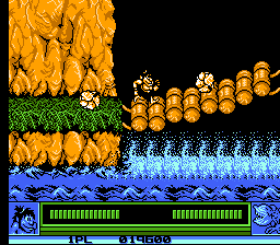 Joe & Mac: Caveman Ninja (NES) screenshot: Dodging boulders on the bridge.