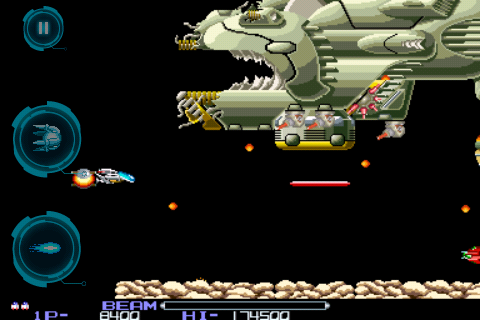R-Type (iPhone) screenshot: Fighting a space battle cruiser.