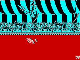 Fiendish Freddy's Big Top O' Fun (ZX Spectrum) screenshot: Jumping through the ring of fire.