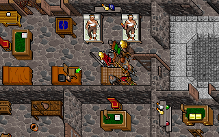 Ultima VII: The Black Gate (DOS) screenshot: The buildings in the game are exquisitely detailed. This here is a hospital. I just put a chair, a book, and some other thing on that bed - to demonstrate the amazing physics