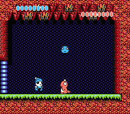 Ufouria: The Saga (NES) screenshot: Your first boss battle. Throw the blue monster ball on this pink guy