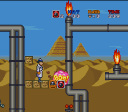 Inspector Gadget (SNES) screenshot: Use bombs to break blocks below