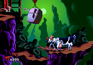 Earthworm Jim (Genesis) screenshot: This cow is a puzzle! Figure out how to launch it