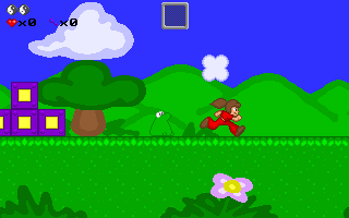Peach's Dream (DOS) screenshot: That hard-to-notice green toad is not friendly: touching it will harm Peach, but she can jump over it.