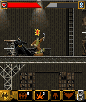 Batman Begins (J2ME) screenshot: Batman attacks multiple enemies.